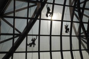 wipe the glass on high roof.