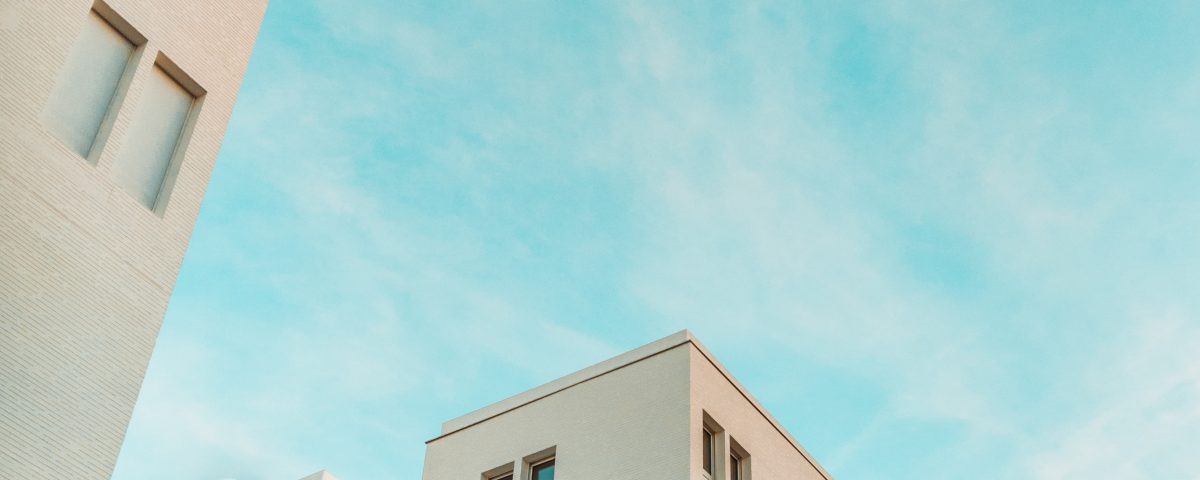 wormview photo of building under cloudy sky