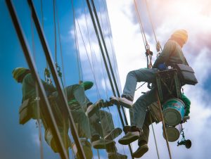 High rise window cleaner. Glass cleaner working. Most dangerous